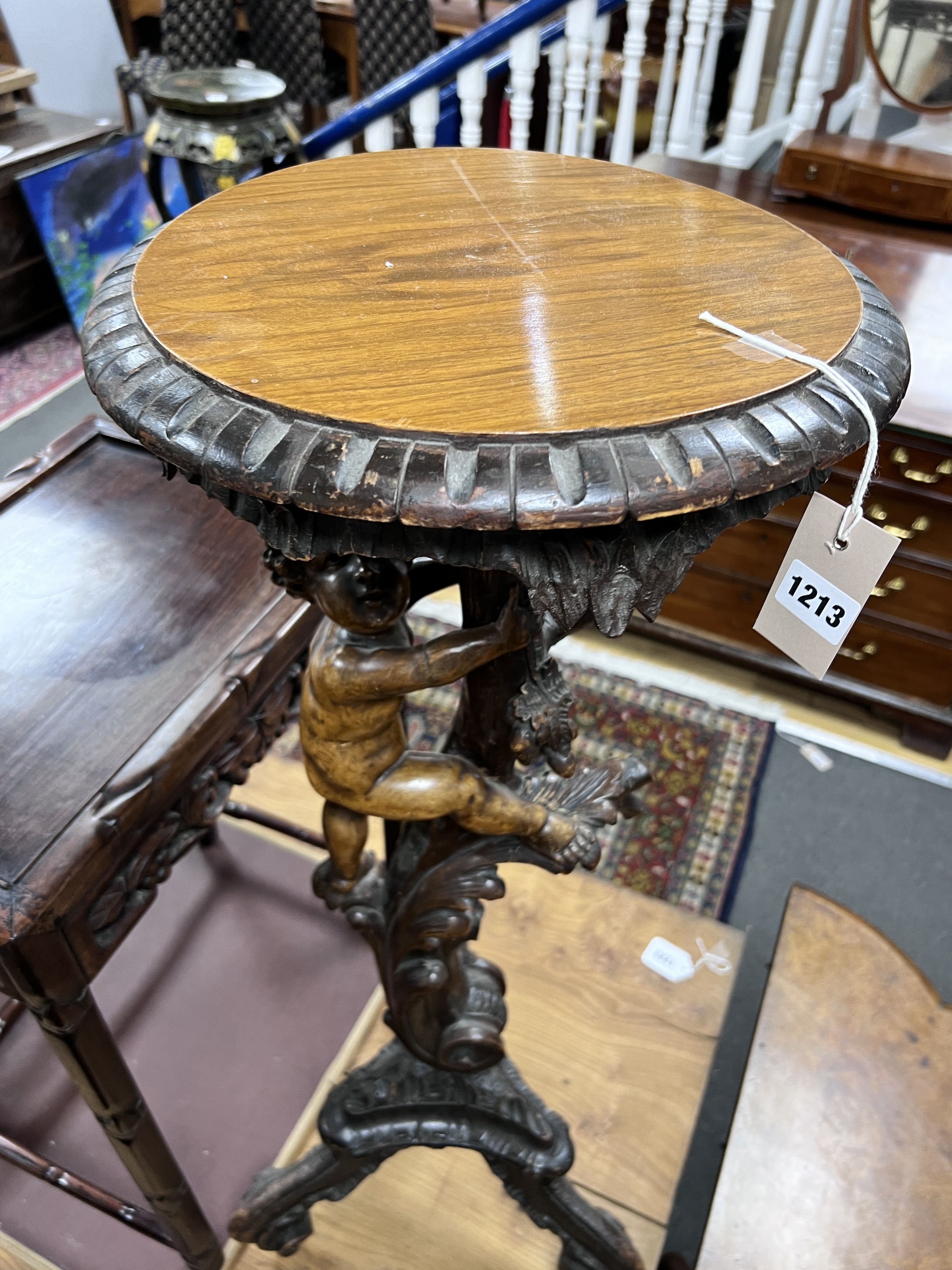 An early 20th century Italian carved walnut and softwood torchere, height 90cm